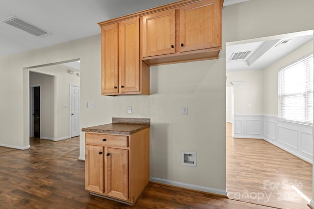 15814 Herring Gull Way, Charlotte, NC 28278 - kitchen featuring a decorative wall, dark wood finished floors, dark countertops, and visible vents