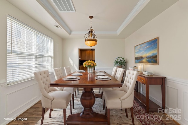 15814 Herring Gull Way, Charlotte, NC 28278 - dining space with a decorative wall, a raised ceiling, and visible vents