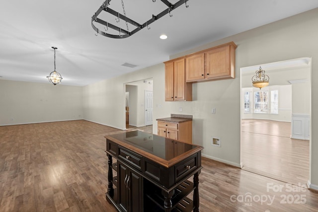 15814 Herring Gull Way, Charlotte, NC 28278 - kitchen featuring open floor plan, wood finished floors, dark countertops, and visible vents