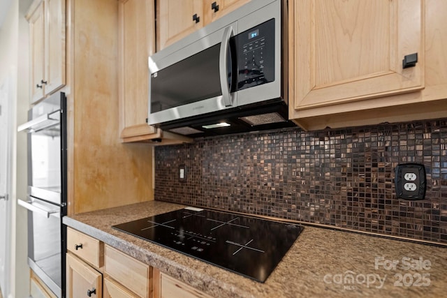 15814 Herring Gull Way, Charlotte, NC 28278 - kitchen with light countertops, decorative backsplash, light brown cabinets, and stainless steel appliances