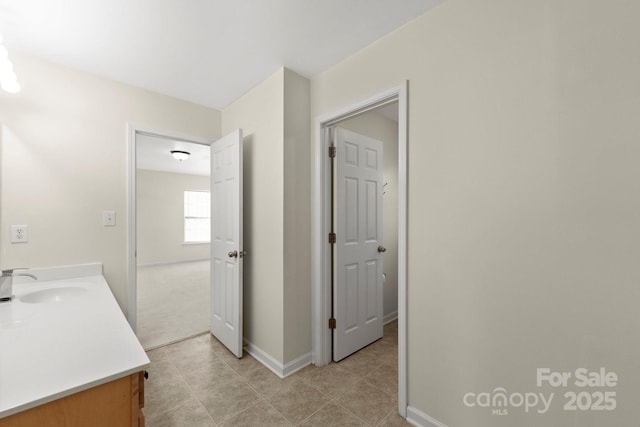 15814 Herring Gull Way, Charlotte, NC 28278 - bathroom featuring tile patterned flooring, vanity, and baseboards