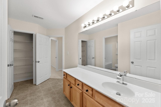 15814 Herring Gull Way, Charlotte, NC 28278 - bathroom with a closet, toilet, vanity, tile patterned flooring, and visible vents