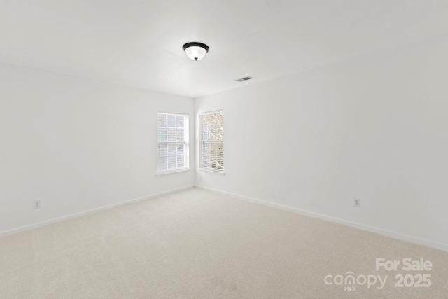 15814 Herring Gull Way, Charlotte, NC 28278 - spare room with baseboards, visible vents, and light colored carpet