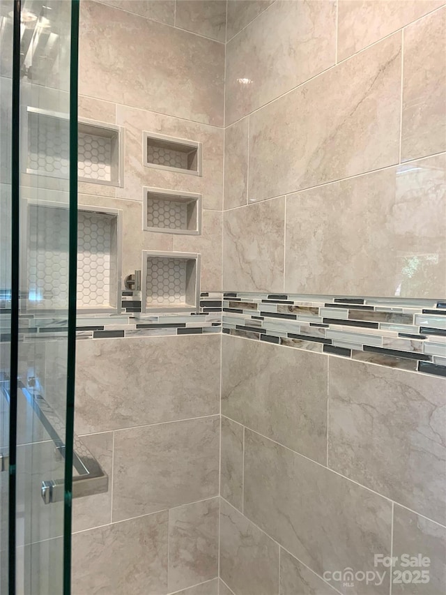 bathroom featuring a stall shower