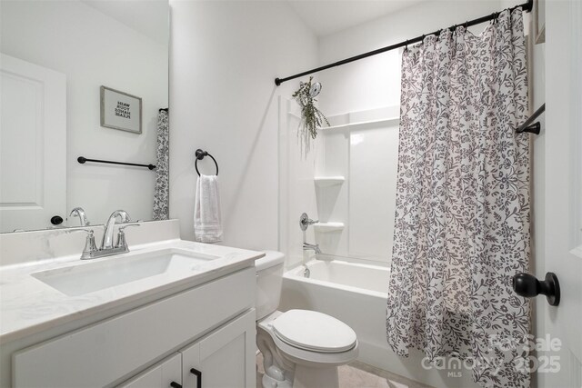 bathroom with toilet, shower / tub combo, and vanity