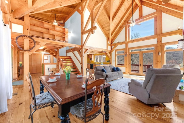 35 Great Aspen Way, Black Mountain, NC 28711 - dining area with high vaulted ceiling, ceiling fan, stairs, light wood-type flooring, and a wooden ceiling with exposed beams