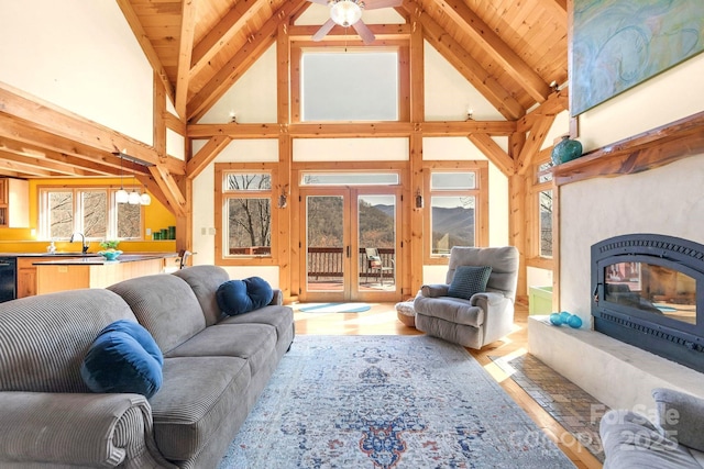 35 Great Aspen Way, Black Mountain, NC 28711 - living room featuring high vaulted ceiling, light wood-style flooring, french doors, a glass covered fireplace, and ceiling fan