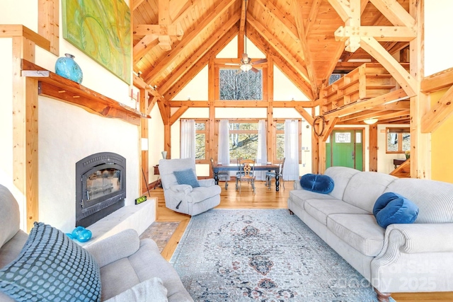 35 Great Aspen Way, Black Mountain, NC 28711 - living area with high vaulted ceiling, wood finished floors, a glass covered fireplace, and a wood ceiling with exposed beams