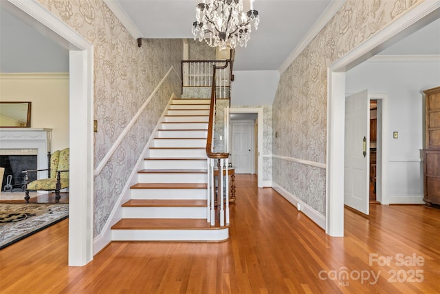 1233 General Hoke Dr, Lincolnton, NC 28092 - stairway featuring a tile fireplace, baseboards, wallpapered walls, and wood finished floors