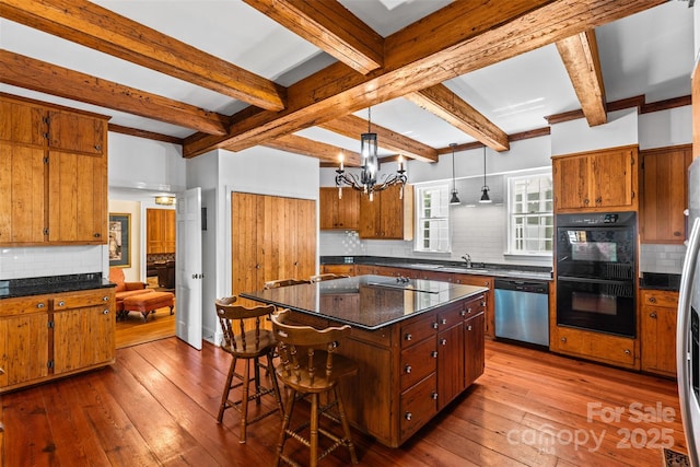 1233 General Hoke Dr, Lincolnton, NC 28092 - kitchen featuring tasteful backsplash, black appliances, an inviting chandelier, and dark wood-style flooring