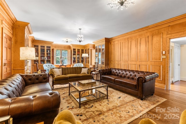 1233 General Hoke Dr, Lincolnton, NC 28092 - living area with a chandelier, wooden walls, crown molding, and wood finished floors
