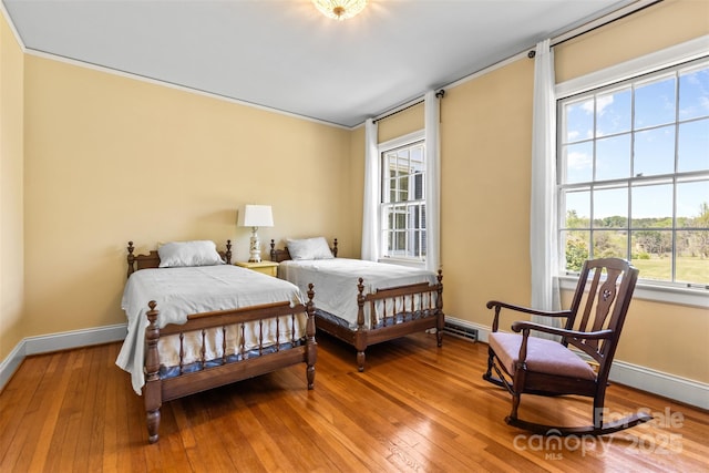 1233 General Hoke Dr, Lincolnton, NC 28092 - bedroom with wood-type flooring, crown molding, baseboards, and visible vents
