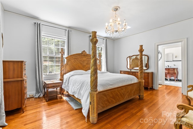 1233 General Hoke Dr, Lincolnton, NC 28092 - bedroom with a chandelier, light wood-style flooring, and baseboards