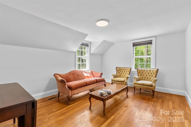1233 General Hoke Dr, Lincolnton, NC 28092 - living area featuring visible vents, light wood-style flooring, baseboards, and a healthy amount of sunlight