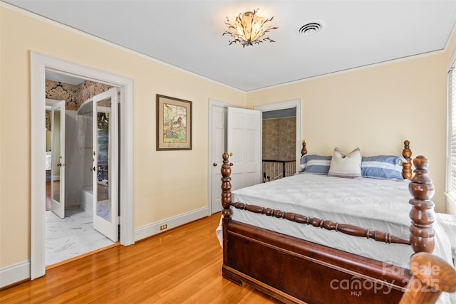 1233 General Hoke Dr, Lincolnton, NC 28092 - bedroom featuring visible vents, baseboards, crown molding, and light wood-style flooring