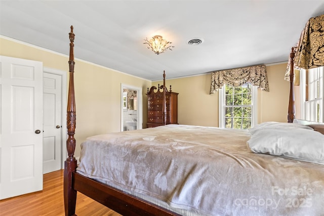 1233 General Hoke Dr, Lincolnton, NC 28092 - bedroom with visible vents, crown molding, and wood finished floors