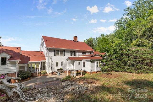 1233 General Hoke Dr, Lincolnton, NC 28092 - back of house with a patio area, roof with shingles, and a chimney