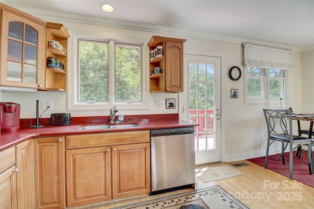 kitchen featuring light wood-type flooring, ornamental molding, open shelves, dishwasher, and a sink