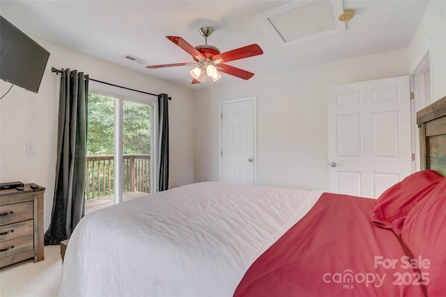 bedroom featuring visible vents, ceiling fan, attic access, access to outside, and light carpet