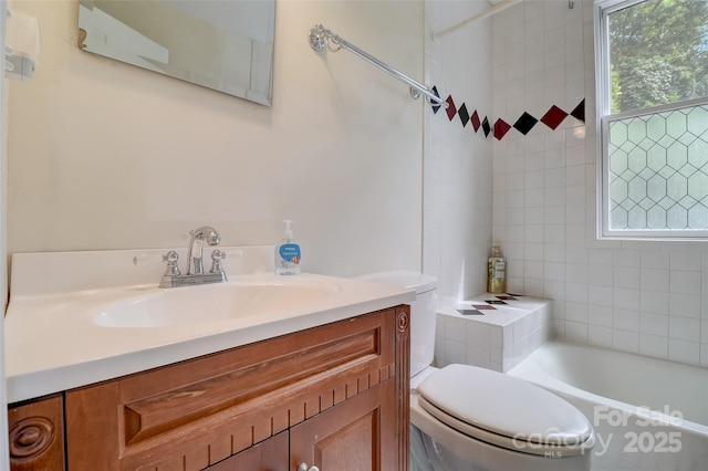 full bathroom with vanity, a tub, walk in shower, and toilet