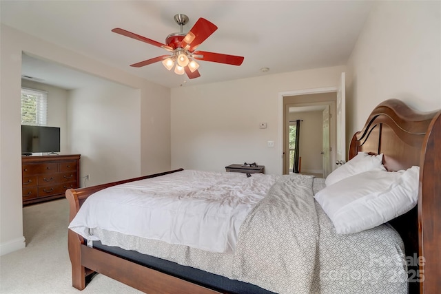 carpeted bedroom featuring a ceiling fan