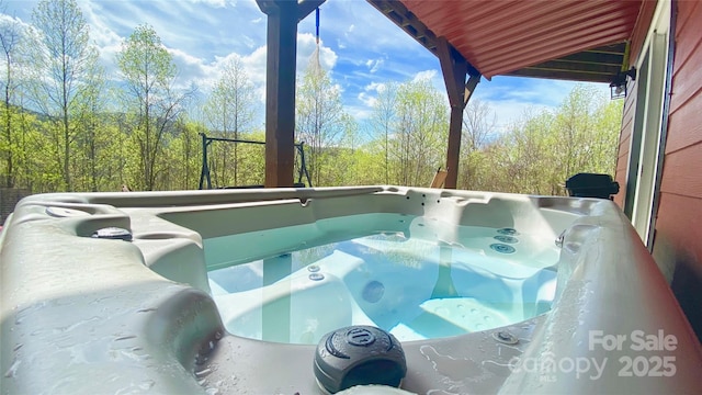 view of pool featuring a hot tub