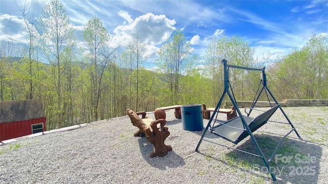 view of play area featuring an outbuilding