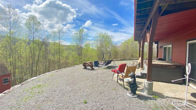 view of patio / terrace featuring a hot tub