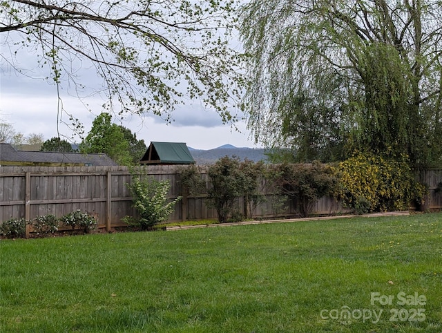 view of yard with a fenced backyard