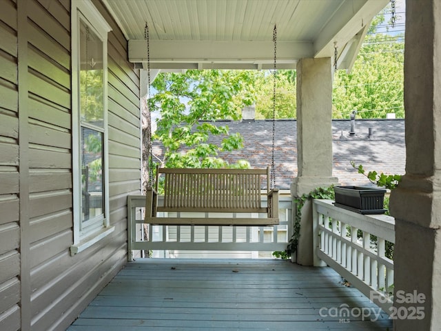 wooden terrace featuring a porch