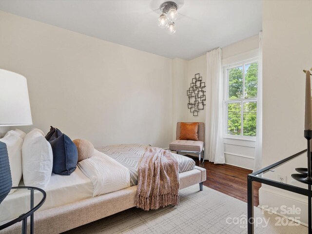 bedroom with wood finished floors