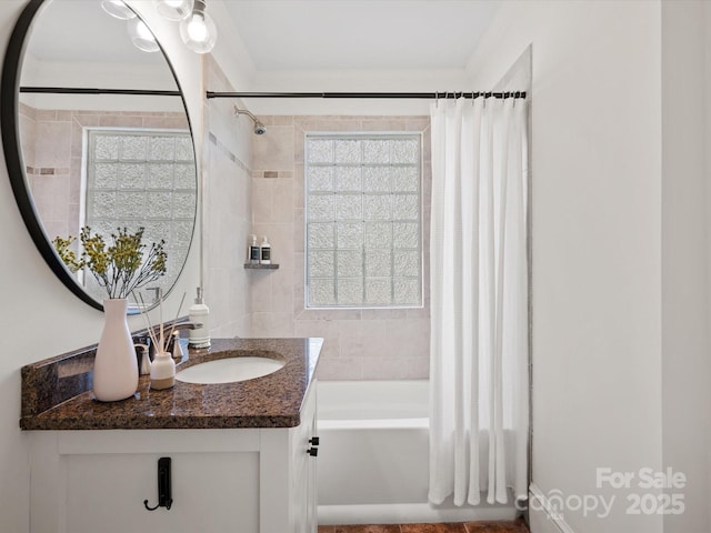 full bathroom featuring vanity and shower / bath combo with shower curtain