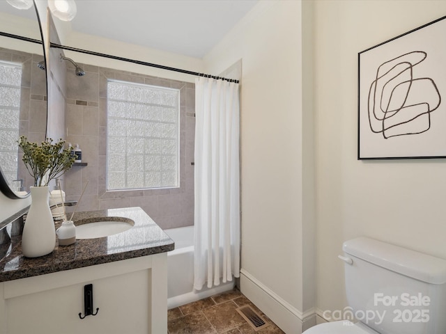 full bath with visible vents, shower / bath combination with curtain, toilet, and vanity