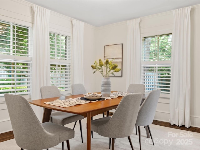 dining area with wood finished floors