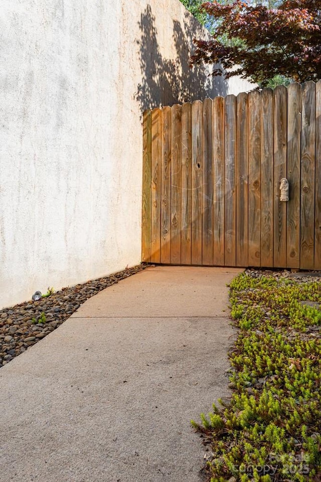 view of gate featuring fence