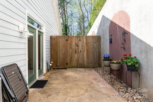 view of patio with visible vents and fence