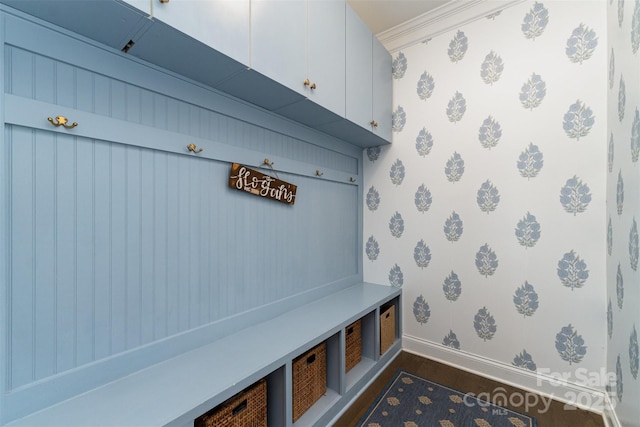 mudroom featuring wallpapered walls, baseboards, and dark wood-style floors