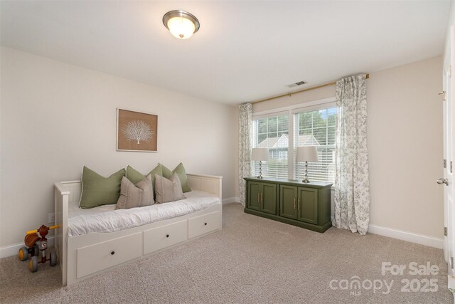 living area with carpet flooring and baseboards