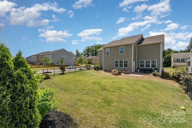 rear view of property featuring a patio and a residential view