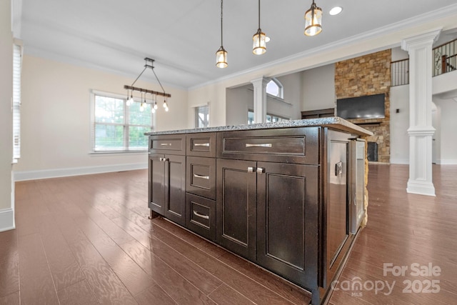 1012 Harper Lee Dr, Newton, NC 28658 - kitchen with dark wood-style flooring, ornamental molding, dark brown cabinets, and decorative columns