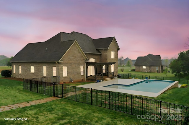 1012 Harper Lee Dr, Newton, NC 28658 - pool at dusk featuring a patio, a fenced in pool, a fenced backyard, and a yard