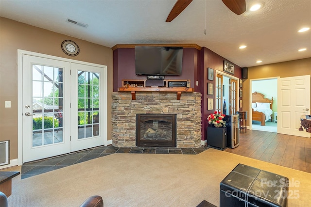 59 Carriage Highlands Ct, Hendersonville, NC 28791 - living room featuring visible vents, recessed lighting, a fireplace, ceiling fan, and carpet floors