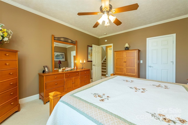 59 Carriage Highlands Ct, Hendersonville, NC 28791 - bedroom with a textured ceiling, baseboards, ornamental molding, ceiling fan, and light carpet