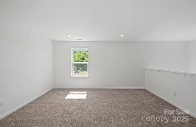 empty room featuring recessed lighting, baseboards, visible vents, and carpet