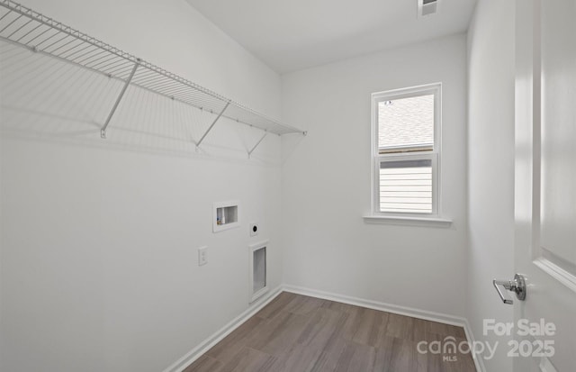 clothes washing area featuring laundry area, wood finished floors, visible vents, hookup for a washing machine, and electric dryer hookup