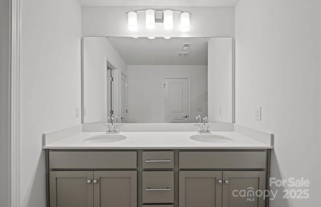 full bathroom featuring a sink and double vanity