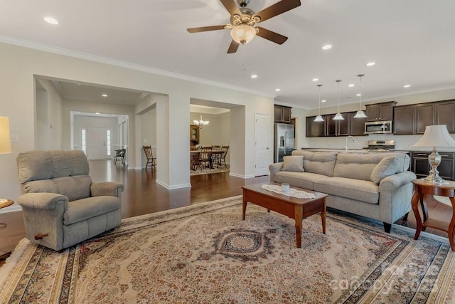 13311 Union Square Dr, Huntersville, NC 28078 - living area featuring baseboards, ornamental molding, recessed lighting, ceiling fan with notable chandelier, and wood finished floors