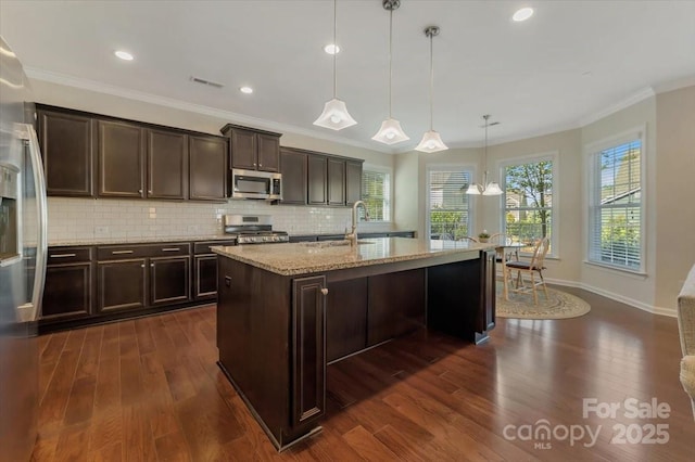 13311 Union Square Dr, Huntersville, NC 28078 - kitchen with light stone countertops, visible vents, dark wood finished floors, stainless steel appliances, and a sink
