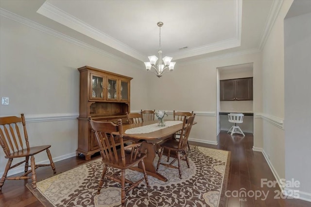 13311 Union Square Dr, Huntersville, NC 28078 - dining area featuring ornamental molding, baseboards, dark wood-style floors, and an inviting chandelier