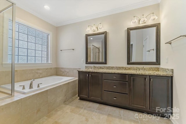 13311 Union Square Dr, Huntersville, NC 28078 - bathroom featuring a bath, a sink, double vanity, and crown molding